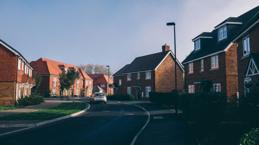 Serene morning view of an English suburban street lined with charming red-brick houses in Farnham.
